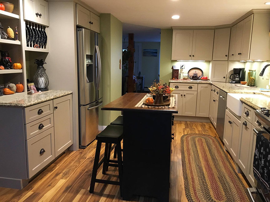 Custom kitchen renovation in Ruston, WA featuring new lighting and tile backsplash